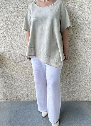 Блуза асиметрична фісташкового кольору