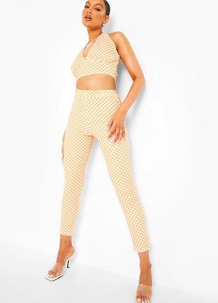 Костюм в шахматку помаранчевий кроп топ лосини