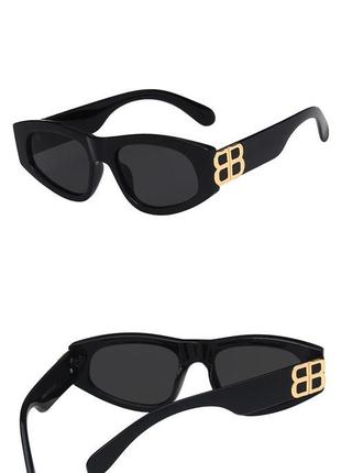Модні сонцезахисні окуляри чорні вузькі овальні ретро окуляри очки 70172 фото