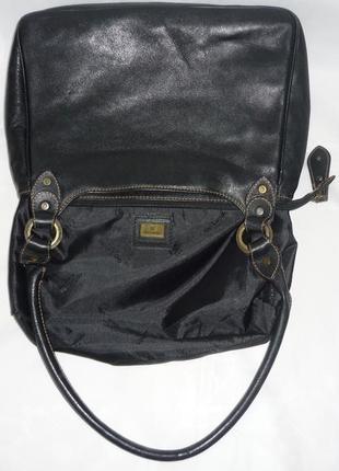 Качественная компактная вместительная кожаная сумка в винтажном стиле производство испания10 фото