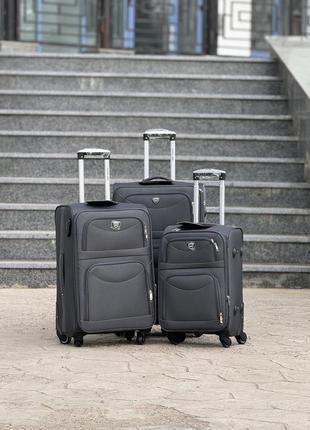 Середня валіза дорожня тканинна m польща на колесах wings з підшипником