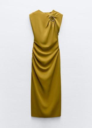 Платье средней длины с золотой аппликацией6 фото