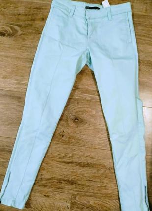 Продам ніжно бірюзові джинси