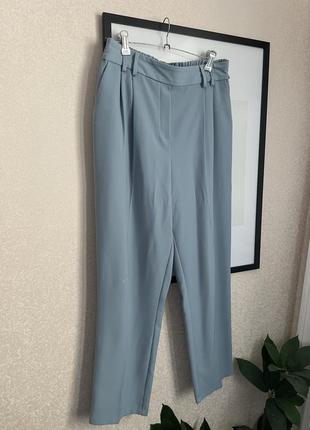 Классные весенние брюки серо голубые с защелками1 фото