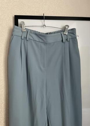 Классные весенние брюки серо голубые с защелками4 фото