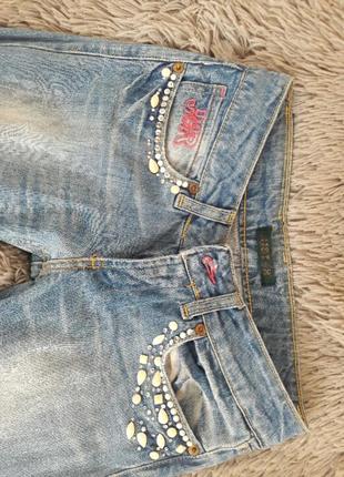 Крутые фирменные джинсы рваный эффект камни бусины3 фото