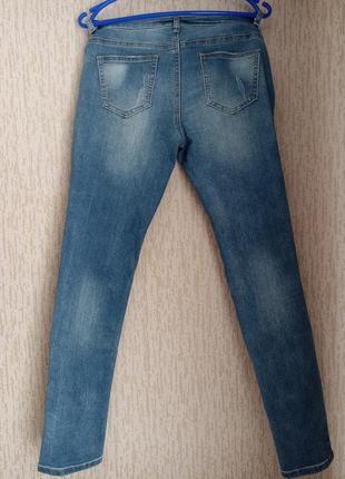 Голубые джинсы зауженные р. l2 фото