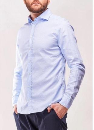 Мужская рубашка синего цвета. фирма exzibit