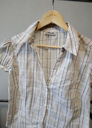 Светлая блуза с коротким рукавом фонариком в клеточку2 фото