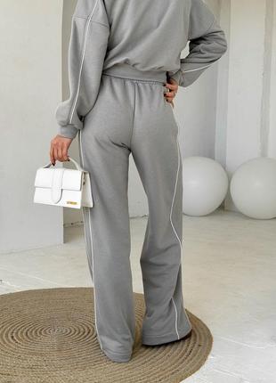 Серый костюм с широкими брюками и кофтой на молнии7 фото