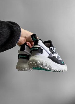 Кроссовки серые с черным nike acg mountain fly low2 фото