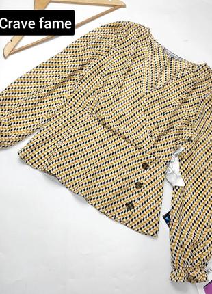 Блуза жіноча в принт вільного крою з широкими рукавами від бренду crave fame m
