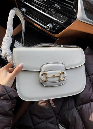 Шкіряна сумка в стилі відомого бренду