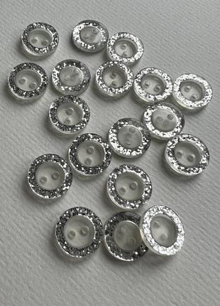 Ґудзик сорочковий бортик глітер прозорий 2отв сірий 17мм пластик