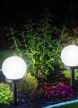 Садові світильники на сонячній батареї led  білого кольору 35 см5 фото