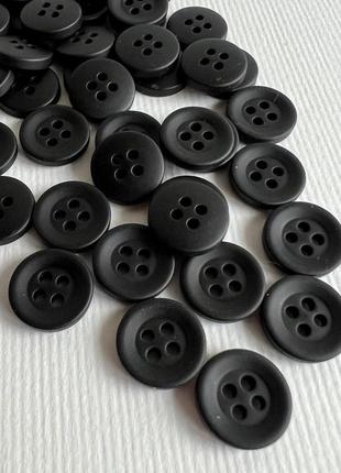 Ґудзик сорочковий матовий 4отв чорний 12мм пластик