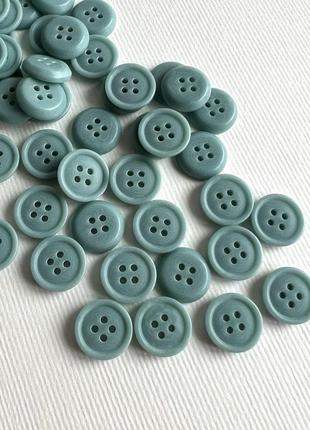 Ґудзик сорочковий тоненький бортик світлий 4отв зелений 15мм пластик