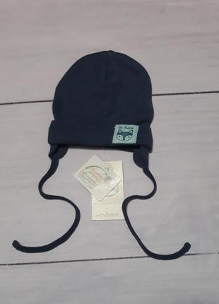 Шапка трикотажна одинарна тонка на зав'язках для новонароджених