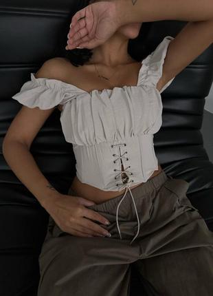 Жіночий топ корсет на шнурівці, укорочений топ з відкритими плечима, з короткими об'ємними рукавами5 фото