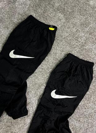 Нейлонові штани nike nylon pants side swoosh2 фото