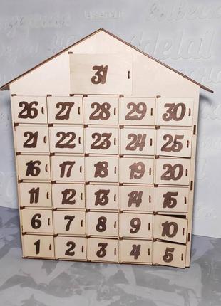 Адвент календарь в виде домика из фанеры.1 фото