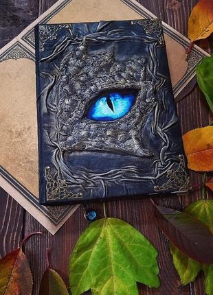 Книга с голубым глазом дракона2 фото