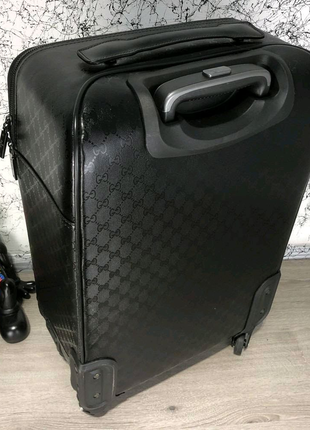 Чемодан gucci rolling luggage

signature 55 with web black /новий