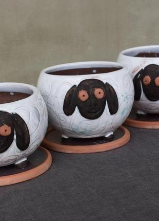 Handmade ceramic pots in the shape of a lamb