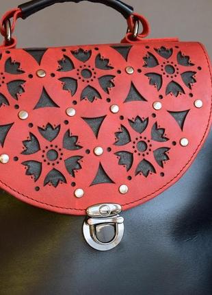 A wonderful compact leather bag with a unique ornament2 фото