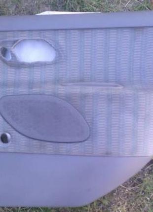 Обшивка двері задня права 93bb-f27406 форд мондео 93р.в. 7163534