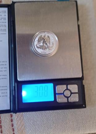 2 срібні інвестиційні монети великобританії.8 фото