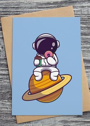 0561 космонавт їсть пончик1 фото