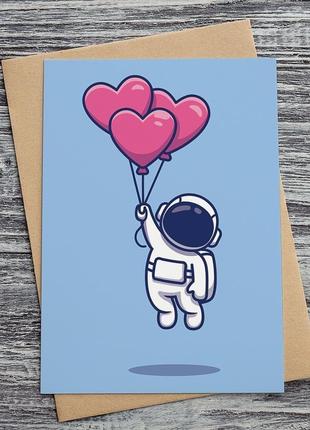 0562 космонавт з кульками сердечками1 фото