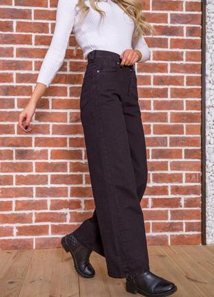Женские джинсы-трубы черного цвета6 фото