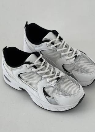 Кросівки жіночі спортивні білі з сірим1 фото