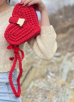 A woven bag in the shape of a heart