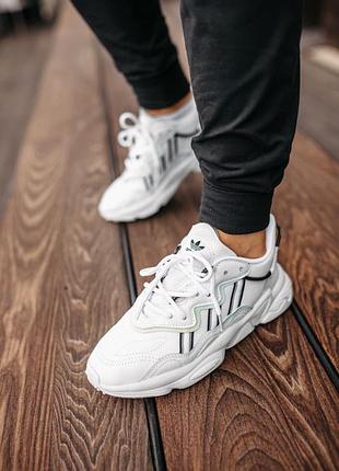 Білі кросівки adidas ozweego