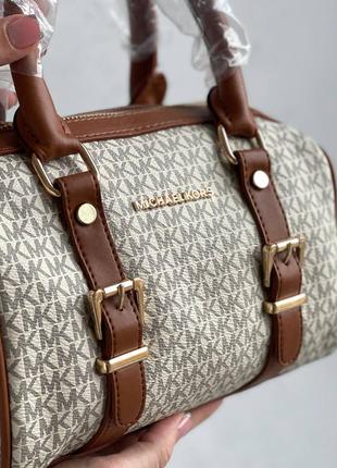 Жіноча сумка michael kors speedy beige brown7 фото