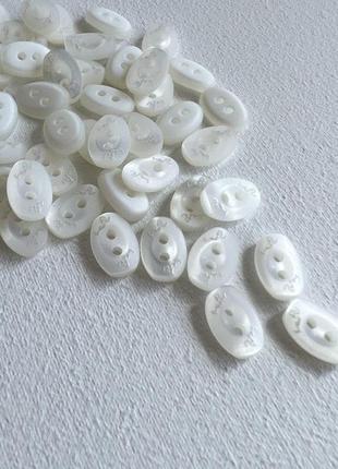 Пуговица рубашечная овальная 2отв белая 11/8мм пластик