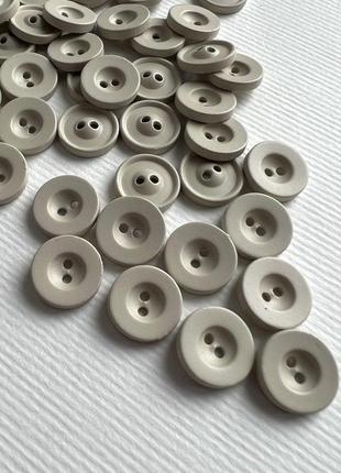 Ґудзик 7/710 сорочковий із бортиком 2отв бежевий 11мм пластик