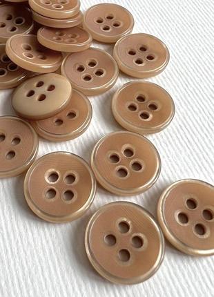 Ґудзик костюмний з глянцевим бортиком матовий 4отв бежевий 17мм пластик