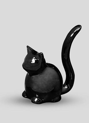 Кішечка, маленька керамічна статуетка.