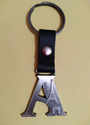 Брелок "а" paris металевий, франція