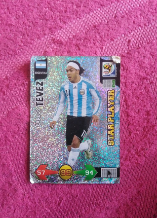 Карточка яка переливається. carlos tevez. panini