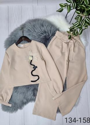 Святковий брючний костюм