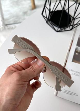 Сонцезахисні безоправні окуляри фігурної форми4 фото