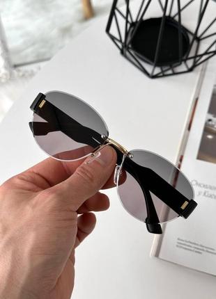 Сонцезахисні безоправні окуляри фігурної форми2 фото