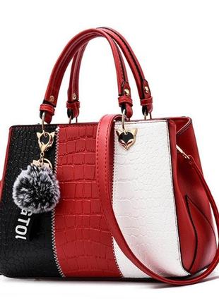 Жіноча сумка на плече чорно-біла комбінована жіноча сумочка екошкіра біла чорна з хутряним брелоком червоний