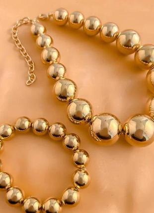 Комплект прикрас із великих золотистих перлів намисто та браслет