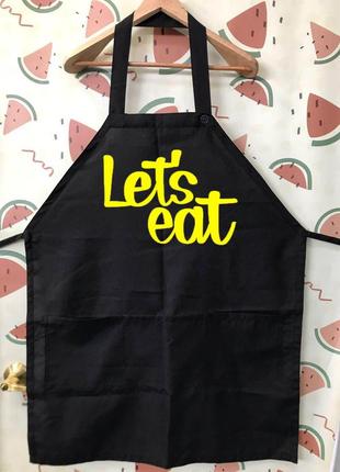 Фа000270 чорний кухонний фартух з принтом "let's eat" (жовтий текст)